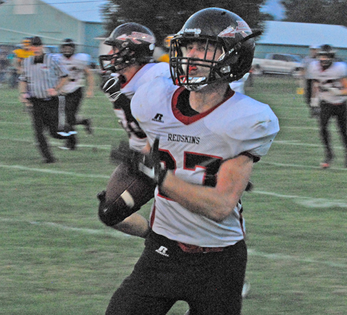 Photo by Mike Brothers Redskin Jake Eaton (27) rolls down the sideline with the end zone in sight as SOV football dominates last Friday’s away game.