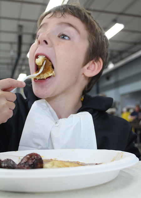 Photo by RR Best Good Eatin’ Connor Denton enjoyed a mouthful of pancakes at the Sullivan Fire Department Pancake Breakfast held from 6 to 10 Saturday morning during Oktoberfest. The 5K Run/Walk followed breakfast which was followed by chili and wine tasting. Nightly entertainment rounded out the 12th annual Chamber sponsored event. 