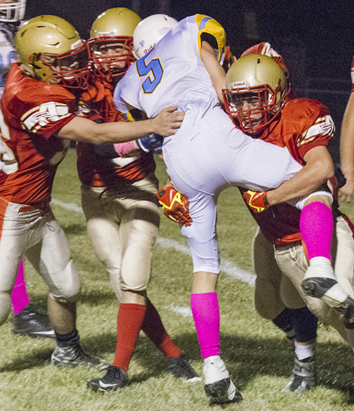 Photo by Keith Stewart Defense came alive as Knights gather for the stop during Friday’s game in Clinton.