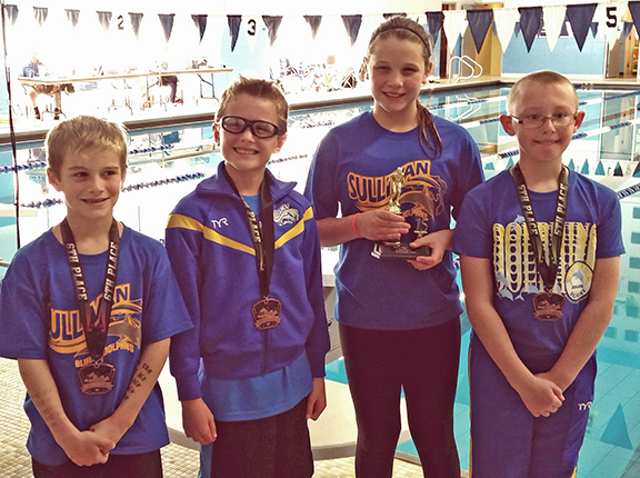 Photo submitted by Jason Smith Blue Dolphins Bring Home Honors Pictured left to right: Mason Booker, Tucker Kull, Sofia Nuzzo and Kaiden Smith.  The Sullivan Blue Dolphins kicked off the short course season October 17 at the Olympia swim meet in Stanford.  They had 13 swimmers out of 30 place in the top six and brought home trophies and medals. In the eight & under division for the boys Tucker Kull placed fourth, Kaiden Smith fifth and Mason Booker sixth. Sofia Nuzzo took second place for the girl’s in the 9-10 age group. In the open division 13 and over Brynna Sentel and McKenna Kull tied for second, Anna Wooters took third, Natalie Drury placed fifth and Allison Oligschlaeger sixth. For the boys open division Tyler Homann placed first, Charlie Goss second and Brodie Goss third place. Gabrielle Spain placed fourth in the 11-12 division.  The 13-14 age group relay team of Natalie Drury, Anna Wooters, Allison Oligschlaeger and McKenna Kull broke two pool records.  First record to fall was the 200 freestyle relay held since 1991 with a time of 1:48.50, the 13-14 girls broke it with a time of 1:46.68. The second record broken was from 1997 for the 200 medley relay with a new time of 1:59.69; the old record was 2:01.38. Head coach Jason Drury said he couldn’t ask for a better start to the season. 