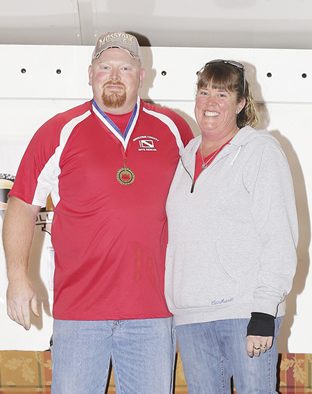 Photos courtesty Heather Casteel Grand Champion- Moultrie County Dive Team, head cook Roger Farley with Amanda Farley.