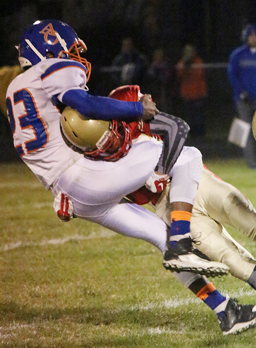 Photo by Darian Hays ALAH Knight Ricky Davis hammers Argenta Oreana Bomber Braxton Norman during play at the Lovington Homecoming game in Arthur October 16.