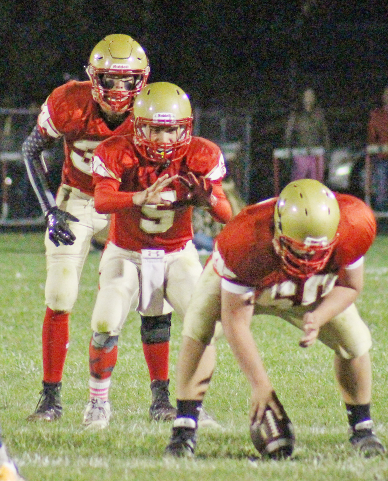 Photo by RR Best Play action for ALAH Knights with Teddy Poe taking the snap from Isaac Kitchen while Tyler Smith is poised to go.