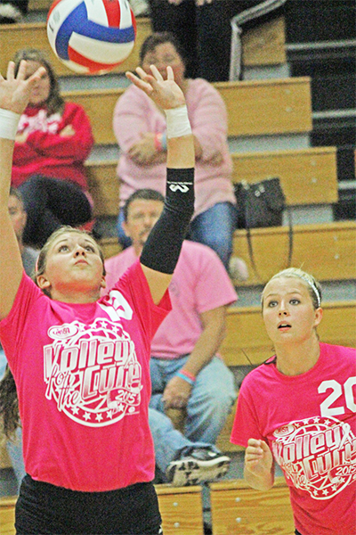 Photo by Darian Hays  Sullivan’s Taylor Booker sets up Jazmyn Jayne against St. Teresa last week.