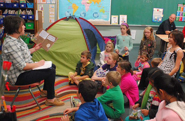  Photo by Mike Brothers Librarian Leah Fleming reads Pigeon Needs a Bath to “campers” during Family Reading Night at Sullivan Elementary School November 19. The Secretary of State Family Reading Night Camping theme was complete with tent and stories around the campfire.