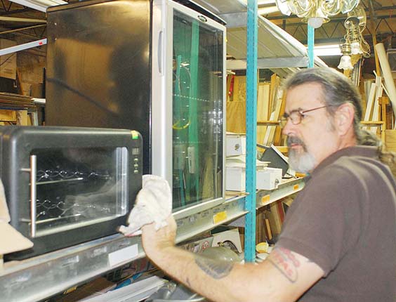 Photo by Mike Brothers ReStore manager Jan Courtright is constantly cleaning and arranging merchandise at the Moultrie County Habitat for Humanity store in Sullivan.