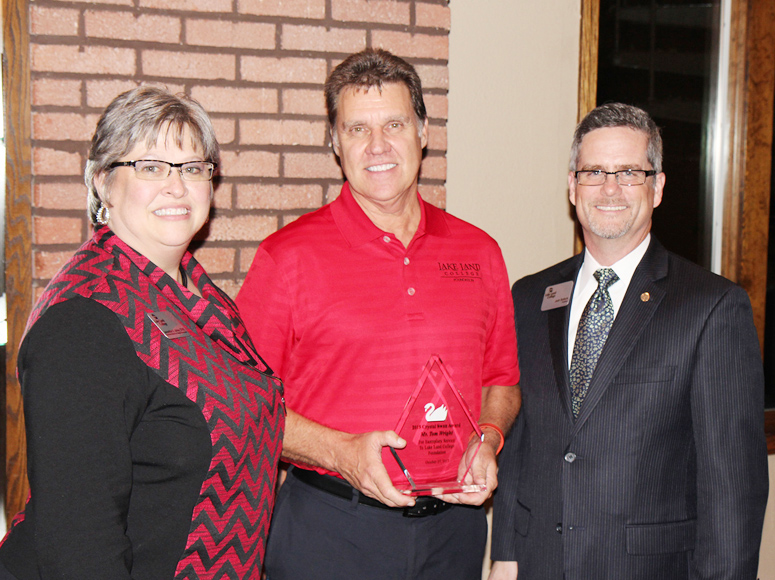 Photo Submitted Award Winner: Tom Wright of Dieterich is the 2015 recipient of the Lake Land College Foundation Crystal Swan Award, which recognizes his outstanding contributions to the Lake Land College Foundation. He is pictured with Lake Land College President Josh Bullock, at right, and Executive Director of College Advancement Jackie Joines, at left.