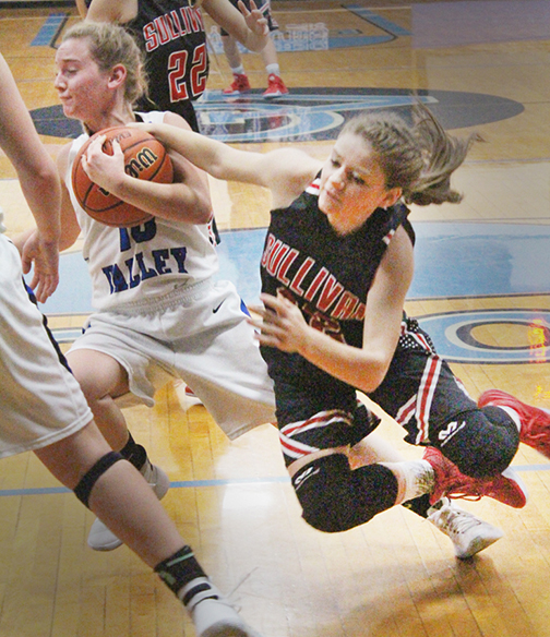 Photo by RR Best Ball possession was important in the Okaw Valley - Sullivan match as Lady Timberwolf Brianna Creviston and Lady Redskin Haley Rose fight for the ball last Thursday.