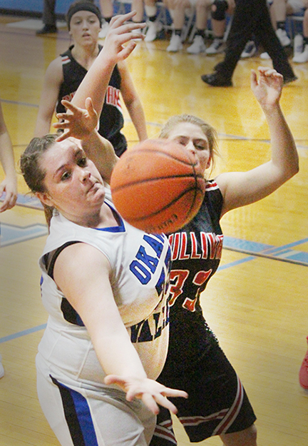 Photo by RR Best At left: During a close game in Bethany between Okaw Valley’s Lady Timberwolves and Sullivan’s Lady Redskins Danielle Lochbaum of Okaw Valley and Sullivan’s Ally Elzy battle for a rebound.