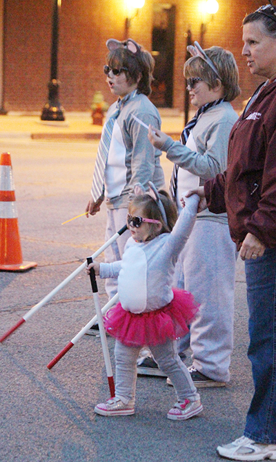 Photo by RR Best Sullivan Costume Parade Winners Winners of the Sullivan Halloween costume parade over the weekend were first place (pictured)-Three Blind Mice, Dustan, LaCosta, Kadden, Klayten, and Kali Abbott; second place- Cabbage Patch Kid, Sophie Utsler; third place- Christmas tree Avery Florey; fourth place- dog (fairy on platform) Brenda Winkowski and Angel; fifth place- Mike Ditka, Bears player - referee, Daniel Wyatt and Keegan Adams; sixth place- scarecrow girl- Adelyn Hill; seventh place- Gru and Minions- Minions- 4 - Blake Martin; eighth place- Bat Man and Robin (dog) Kinsley Eads; ninth place- band director Mickey Mouse Brock Feece and tenth place- doughnuts and policeman Blaine and Laynie Zbinden. 