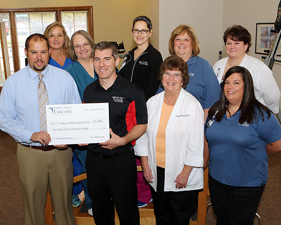 Photo Submitted SBL Sullivan Clinic Donates to Sullivan Athletic Booster Club Sarah Bush Lincoln Sullivan Clinic recently donated $1,680 to the Sullivan Athletic Booster Club from sports physicals performed over the summer. The physicals were provided at reduced costs to numerous athletes by Matthew Dorner, MD, and Tammy Munch, PA-C, who donated their time. The physicals were $20 each, and all the proceeds were donated back to the school. Pictured are (back row, left to right) Connie Lane, Wanda Norris, Tiffany Kuebler, Beth Cook, Tonya White; front row: Athletic Director Ryan Aikman, Dr Matthew Dorner, Tammy Munch PA-C, Teresa Harlin.