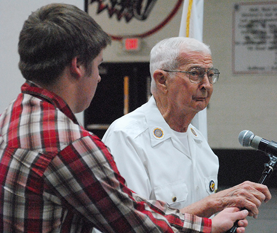 Photo by Mike Brothers Careers student Brad Kay introduces WWII veteran Myron Haney.