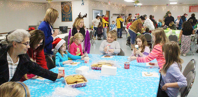 Photo by RR Best Holiday Fun at the American Legion Following the annual Sullivan Christmas parade the Sullivan American Legion Post hosted adults and children for refreshments and a chance to let Santa know what they wanted for Christmas.