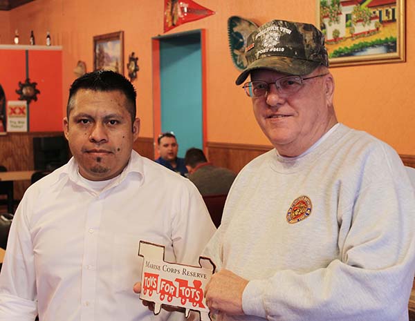 Photo by Mike Brothers Toys for Tots Toys for Tots is growing in Moultrie County with collection sites such as the one at Los Potros on the square in Sullivan. Los Potros manager Honorio is taking donations and displaying Toys for Tots trains with donors’ names around the counter. Local chapter coordinator Ric Kenney (pictured right) explained folks may make donations at several locations around Moultrie County including EK Petro, Sullivan VFW, Red Apple Restaurant, Monical’s Pizza, Subway, Dolllar General Store, First National Bank, Scott State Bank and First Mid Illinois Bank & Trust. Toys for Tots works with Secret Santa in Sullivan and Sparrows in Lovington to help with their individual toy drives.