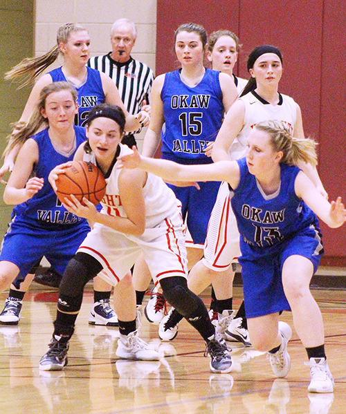 Photo by RR Best ALAH Knight Janette Comstock protects the ball as Okaw Valley Timberwolves (from left) Chloe Weybright, Devan Nave, Natalie Jeffers and Brianna Creviston close in.