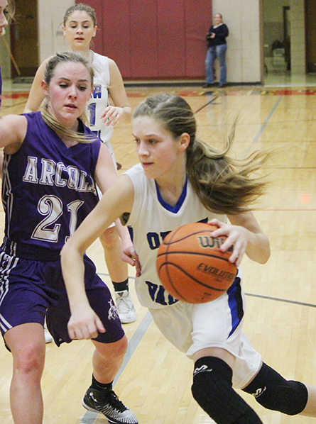 Photo by Darian Hays Paige Robinson drives against Purple Rider Rylee Fishel for two of her game leading 17 points, helping the Knights to a 42-30 wind over Arcola.