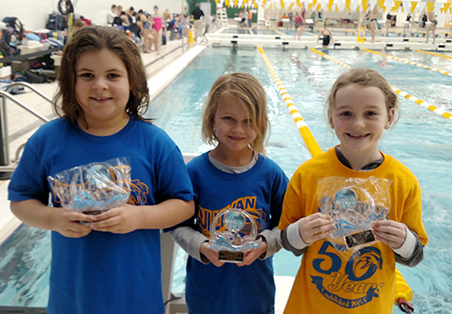 Photo by Kim Drury Blue Dolphins competed at Terre Haute Valentine’s Day  weekend. Pictured from left:  Alivia Melvin, Cadence Schmohe, Meredith Chambers.