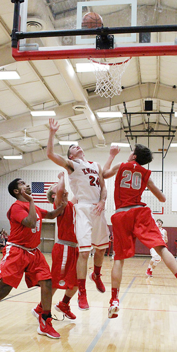 Knight Jakob Brewer leaves three Decatur LSA Lions behind going up for two of his 17 points in the ALAH win February 5.