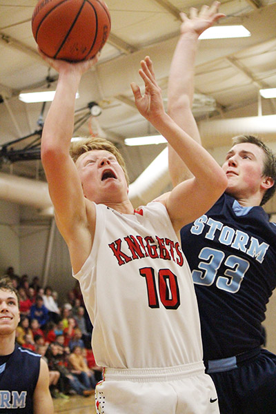 Photo by Darian Hays Cade Day goes up for a field goal against Sangamon Valley Feb 19. Day also pulled down five rebounds in the win.