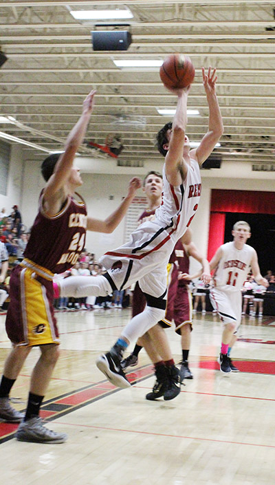 Photo by ghgh Redskin Ty Molzen is up and inside for a score as River Edwards eyes the potential defensive setup in the Feb 19 win over Clinton. 