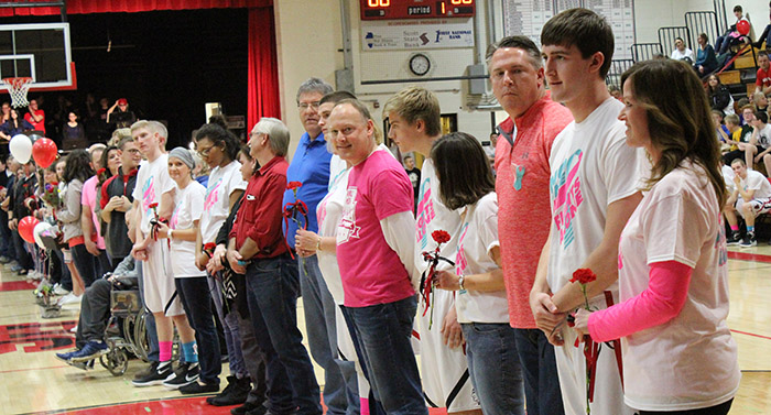 Photo by Mike Brothers SHS Senior Night  Held between the junior varsity and varsity basketball games on February 19, seniors from the SHS pep band, cheerleading squad, basketball team and their parents lined the gymnasium end to end. Prior to the senior recognition Ty Molzen (second from right) was recognized for scoring 1000 points by head coach Chester Reeder. 