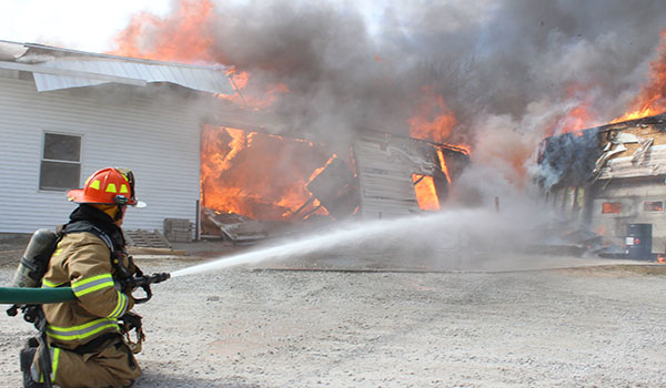 Photo by RR Best Fire Destroys Woodworking Business Sullivan Fire Department joined other first responders from Bethany, Lovington, Findlay, Arthur and Windsor to a 1:45 p.m fire Tuesday, March 8 south of Sullivan and west of Highway 121. Ivan’s Woodworking at 1421Cr 1275N, Sullivan was engulfed in smoke when firefighters arrived.  Fire that started at the west end of the manufacturing/office complex quickly engulfed the building as area departments scrambled to get adequate water supplies to the location. Owned by Ivan Schrock, the company has manufactured custom wood chairs, hardwood floors and interior wood products since 1993.