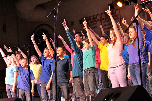 Photo by Sonya Best Show Choir Invitational Sullivan Singers sponsored an Invitational Show Choir competition with performing groups traveling from all over the Midwest to compete. In addition to an intense weekend of high school show choir competition there was time to showcase future Sullivan talent. Above the Sullivan six grade choir dazzles the invitational crowd.