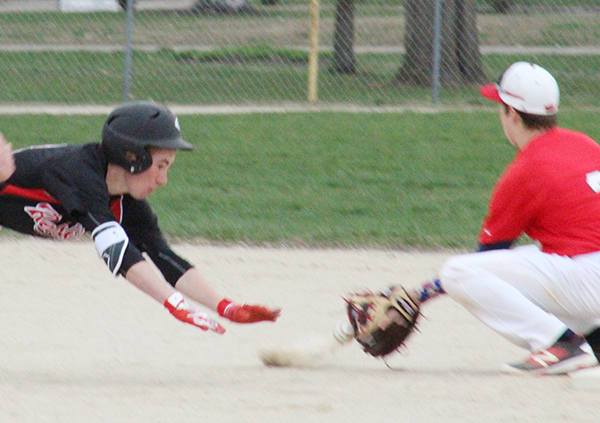 Photo by Mike Brothers Brett Tuttle dives safely back to second after stretching a long single in a 4-3 win in Sullivan baseball action against Heritage last week.