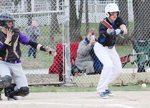 Photo by Mike Brothers Timberwolves Taylor Coleman lays down a sacrifice bunt, advancing runners to second and third base during Okaw Valley High School baseball’s win over St. Elmo March 23.