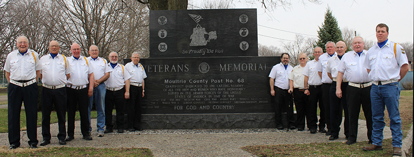 Photo by Mike Brothers Sullivan American Legion Post 68 Color Guard from left: James Darnell, George Selby, Bob Sims, Ed Riley, Charles Bragg, Mike Gross, (the Memorial) then Mike Black, Mac Bond, Mike Keown, Jon Garvin, Marty Reynolds, Richard Murphy and Nathan Selby.