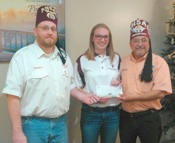  Photo furnished Shrine Club Presented with Donation The Tri-County Shrine Club was presented a donation from the Arthur-Lovington/Atwood-Hammond ugly sweater contest held during the holidays. Shrine Club president Jeremy Malin and ALAH freshman Emma Harris presented the donation to Noble Ed Camacho, Potentate of Ansar Shrine Temple in Springfield at Yoder’s Country Kitchen in Arthur. This is the second year ALAH has donated the ugly sweater donations to the Shriner’s Crippled Children’s Hospital in St. Louis. Participants donated $1 for each ugly sweater vote to raise funds. Harris is the daughter of Mr. and Mrs. Stan Harris of Atwood. Stan Harris is the Second Ceremonial Master of Ansar Temple.