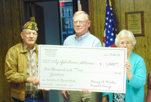 Eric Kenney photo Sullivan Receives VFW Gift VFW # 6410 Commander, Russell Craig, presented park commissioner Mike Mossman and city of Sullivan mayor Ann Short with a $1000.00 grant from the VFW Foundation which is for the Wyman Park Summer Youth Recreation Program. The presentation was made during the March 28 Sullivan City Council meeting.