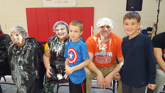 Photo  furnished Pie in the Face was done for Box Top Collection at Sullivan Elementary School.  The students are Rhyder Pierce on the left and Liam Donovan on the right.  The teachers are Melissa Haegen on the left, Micah Heddins in the middle, and Kurt Friese on the right.  Students got to play the “Pie in the Face” game as a reward for collecting box tops in December.