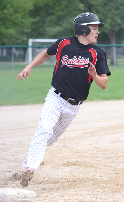 Photo by Darian Hays Sullivan Redskin Alec Ballinger rounds third, checking defense before making a dash for home.