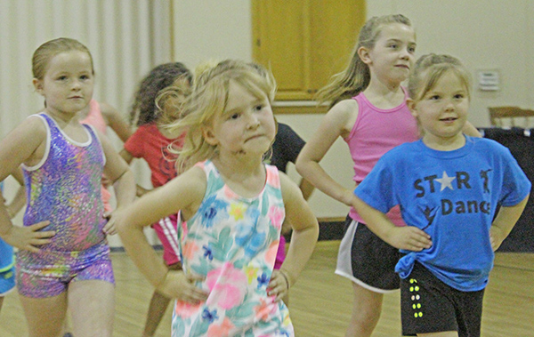 Photo by Mike Brothers Studio for Young Dancers Dancers with Miss Melissa’s new studio are meeting at the First United Methodist Church in Sullivan until the permanent location downtown is completed. Above (from left) Emily Tilton, Chloe Jensen and Ava and Layla Corley go through their routine. See Ariana Cherry’s story on page 5.