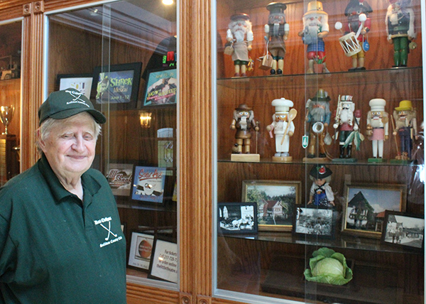 Photo by Mike Brothers Das Clubhaus owner Don Frevert welcomes visitors to the Sullivan Country Club with display cases filled with his nutcracker collection and show bills from the Little Theatre. Once inside the dining room, golf course views are featured from every table.