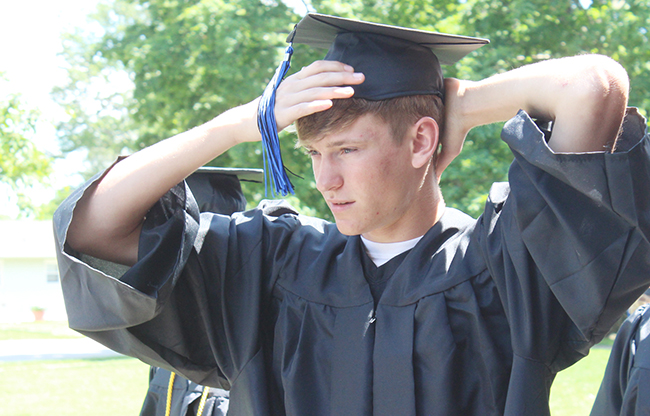 Photo by RR Best Dylan Park adjusts his cap before Okaw Valley High School graduation ceremonies in Bethany Sunday, May 29. Thirty three graduates received diplomas during the outdoor ceremony.      PTO Provides         Help with Funding     The continued underfunding of schools in Illinois is no secret.  Fortunately, the Sullivan PTO has stepped up its efforts to provide opportunities for the students of Sullivan Elementary School.