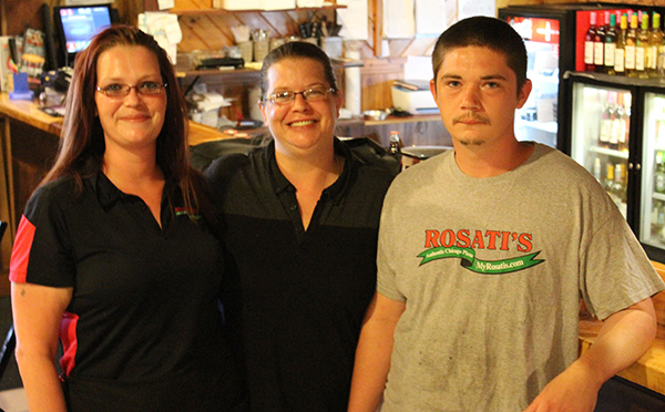 Photo by Mike Brothers Ready at Rosati’s — Under new management Rosati’s is ready to serve area customers hungry for deep dish Chicago styled pizza and a variety of other dishes. Above Lauren Lillico, manager Julie Fifer and Josh Pitts prepare for the day.