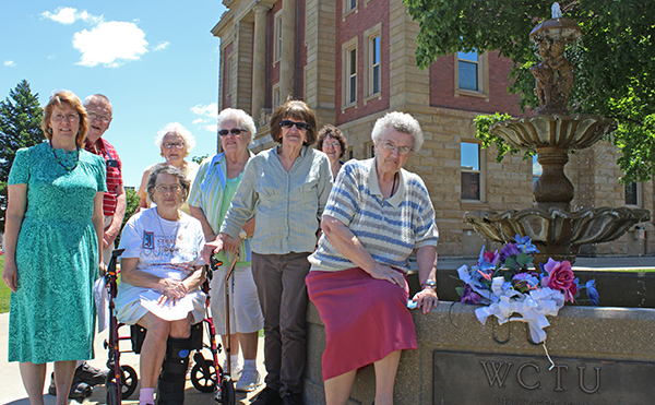 Photo by Mike Brothers Fountain Honored with Memorial The East Central Illinois Woman’s Christian Temperance Union placed a wreath on the WCTU fountain located on the Moultrie County Courthouse lawn Tuesday, June 7. The wreath commemorated Frances Willard who founded WCTU in the late 1880s. Local members participating in the noon ceremony, which included prayer and a song, were Marjorie Miller, Mary Blue and Laura Ayers of Sidney; Jim and Shirley Rideout of Kansas; Debbie Mitchell of Pesotum, Ann Roley of Charleston and Norma Taylor of Mattoon. The fountain in Sullivan was constructed after WCTU members were urged to erect drinking fountains to prevent men from going to saloons. The fountains became popular for watering horses and pets. There are 88 fountains remaining in the United States. The next WCTU meeting is 10 a.m. July 5 at the Dutch Kitchen in Arcola.