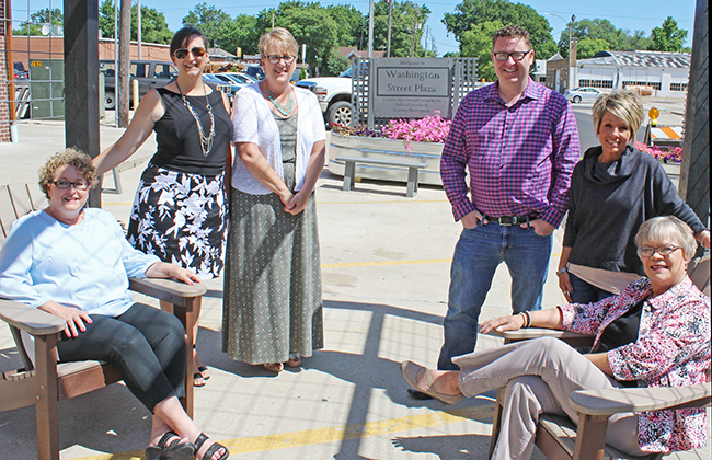 Photo by Mike Brothers Washington Street Plaza is Sullivan Chamber and Economic Development’s newest project, east of the Little Theatre, offers visitors a place to relax before and after shows or while strolling around the square.  Above SCED’s Stepheny McMahon and Laurrie Minor are enjoying the plaza along with The Little Theatre’s Brenda Abbott, John Stephens, Nikki Schlieker and Lori Harbaugh.