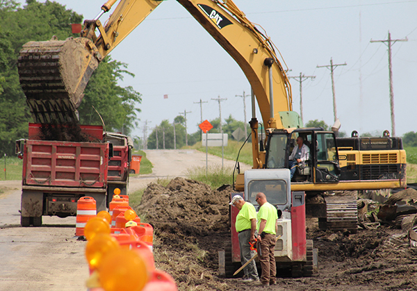 Photo by Mike Brothers Progress is underway on straightening Wilborn Creek Road as part of the county’s road rehabilitation project. Above Moultrie County employees check measurements at the straightening site. The project is expected completion by August.