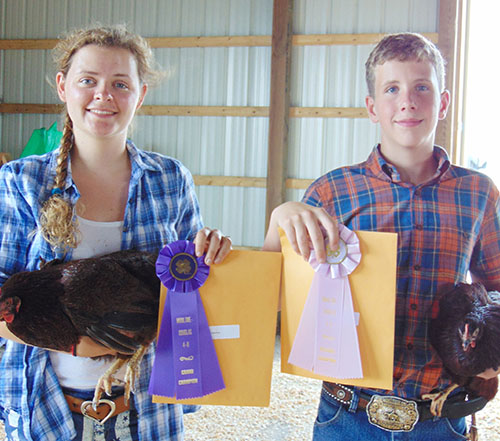 Photo furnished Mo-Do Fair Ribbon Winners Winning ribbons in the Moultrie Douglas Fair 4-H Livestock show were Blair Monroe of Bethany and Ben Bushue of Sullivan.