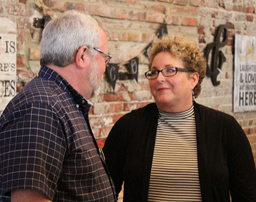 Photo furnished Open House Honors McMahon An open house was held at Cathrine’s Gallery Gifts and More for outgoing Sullivan Chamber and Economic Development director Stepheny McMahon Friday, July 8. Pictured above with Mike Kirk, business owners, chamber directors, friends and family gathered to wish McMahon the best with her new career at First Mid Illinois Bank. Laurrie Minor is interim director.