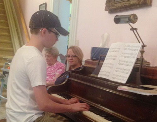 Photo furnished Pictured above playing the piano is Reagan Crouse.