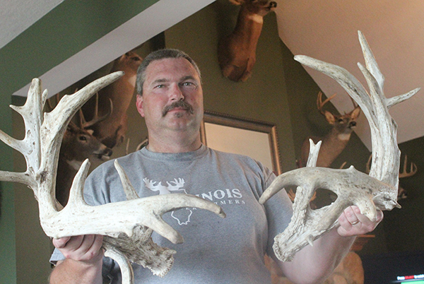 Photos by Stu D. Baker Travis Phelps displays an antler rack from a four year old buck, about twice normal size.