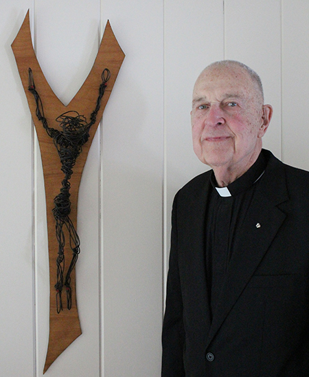 Photo by Mike Brothers Tortured Crucifix Thirty years ago Father Tom Brown of Quincy sculpted the crucifix at Father Sohm’s right. Made from hand twisted wire coat hangers Father Brown intended it to represent the torture Jesus underwent on the cross.