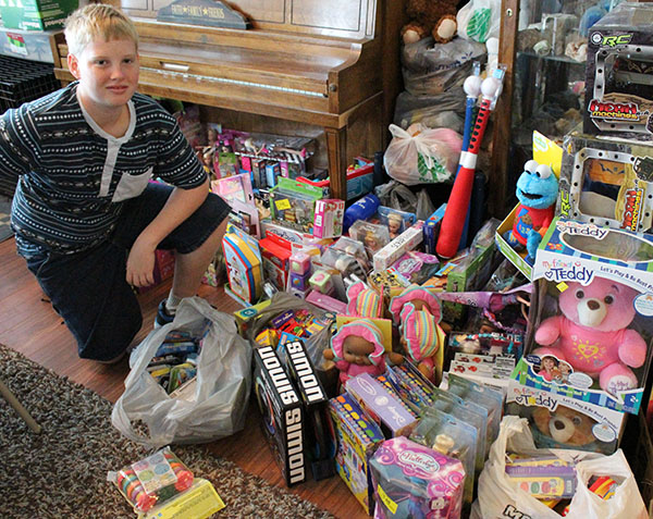 Photo by Bernie Sanders Seth Webner of Bethany isn’t letting juvenile rheumatoid arthritis slow him from collecting toys for other patients at Shriner’s Hospital in St. Louis. He is collecting more toys from the public at the Sullivan Church of God on Aug. 20.