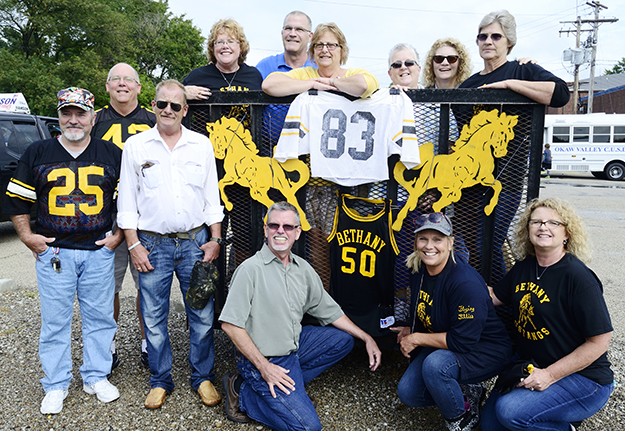 Photo courtesy Patrick Tueth Mustangs Return Featured in Bethany’s homecoming parade and other festivities this past weekend was the graduating class of 1976. According to those in attendance, no one has changed a bit in the 40 years since they roamed the halls of Bethany High School.The sports teams were known as the Mustangs in those days. Pictured are Kim Abbott, Bill Reeter, Patrick Tueth, John Hill, Sheila (Standerfer) Smith, Doug Moore, Cheryl Robinson, Susan (Iler) Schwartz, Donna (Martin) Fowler, Jane (Harshman) Inman, Tammy (Miller) Stinson and Pam (Richardson) Stetler. 