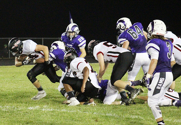 Photo by Mike Brothers It was tough making ground but Luke Bowman leaves Shelbyville’s defense plowing through for a modest gain.