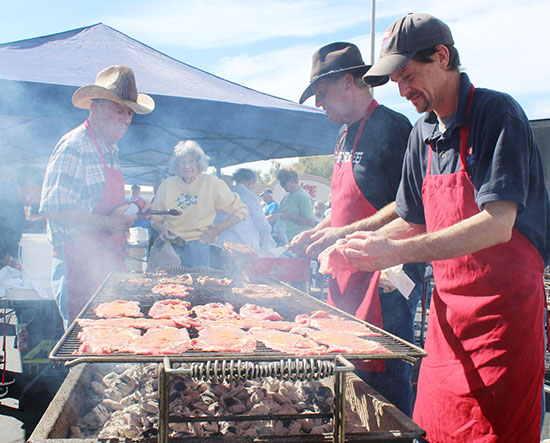 Photo by Mike Brothers Round Up Time Crowds filled the Sullivan IGA parking lot at high noon October 7 for a beef showdown. There were freshly charcoaled ribeye sandwiches served at 11:30, and a beef brisket cook off which was won by the Sullivan Fire Dept. While strolling around with a ribeye sandwich, crowds were guessing the weight of a prize Hereford bull, looking at Joe Scribner and Rick Montague’s beefed up cars and watching Gail Wolfe give free pony drawn wagon rides. The Sullivan American Legion Color Guard made a special appearance, and Bob Vail performed the national anthem. 